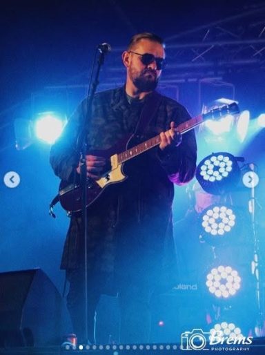 A man singing at a music concert