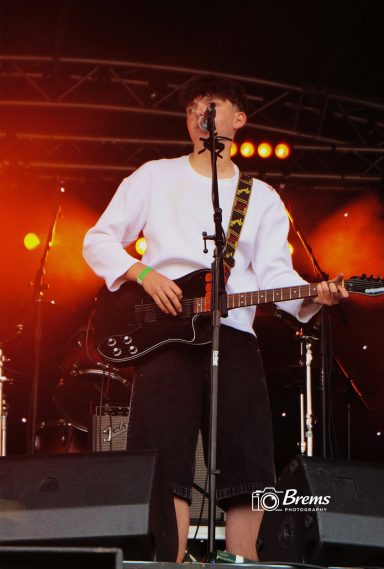 A member of Nook band playing guitar